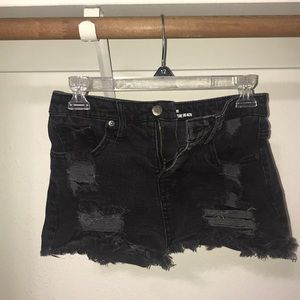 ripped black shorts.